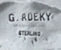 G. Adeki hallmark