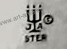 JA with a candelabra mark is James Avery Craftsman Inc.