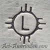 L inside a sun mark on Native American jewelry is Lewis Lomay (Lomayesva) Hopi