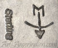 M over bow and arrow mark